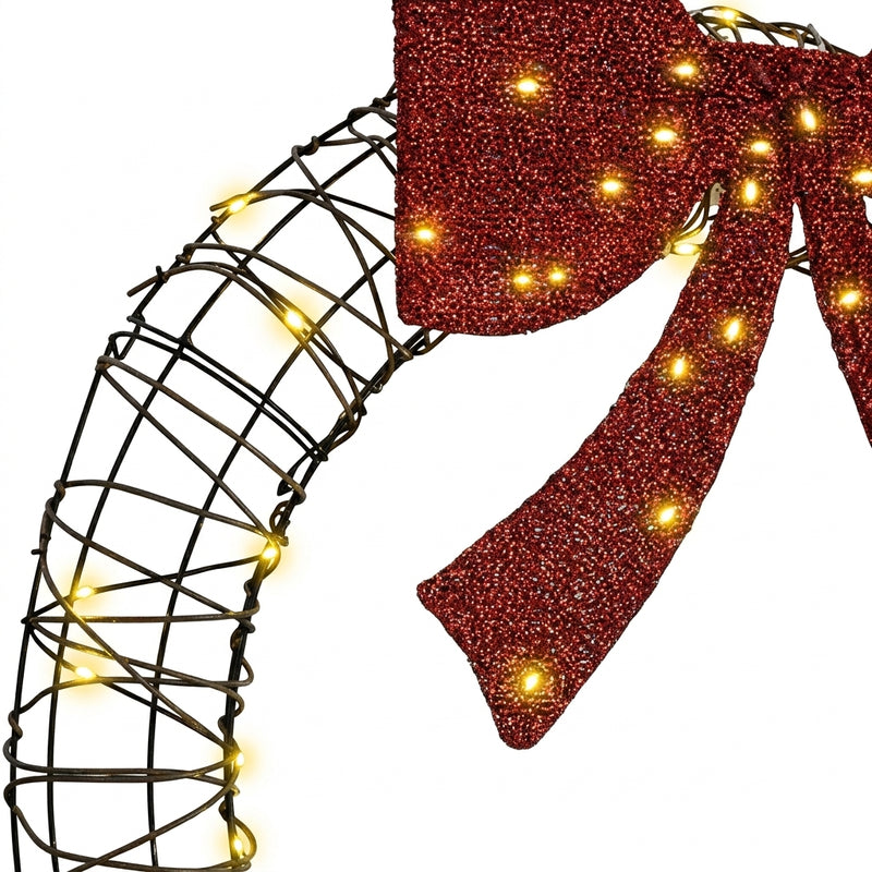 Couronne de Noël lumineuse en rotin avec nœud rouge